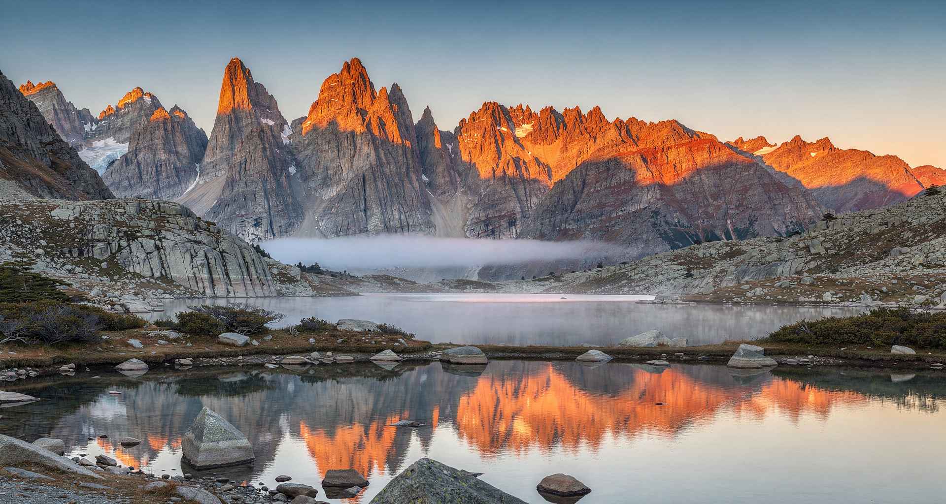 Golden sunrise on granite mountain peaks in Patagonia